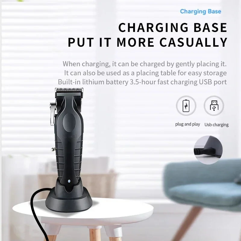 A black electric hair clipper grooming kit charging base with a cord placed on a white table.