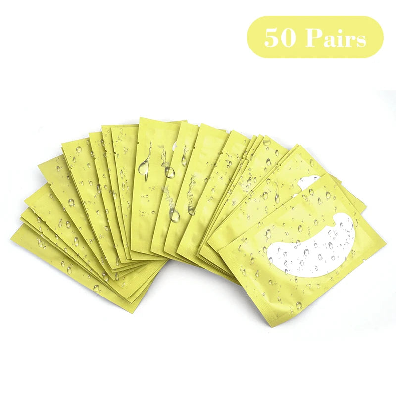50 paires de pads hydrogel jaunes pour extensions de cils, empilés et exposés.