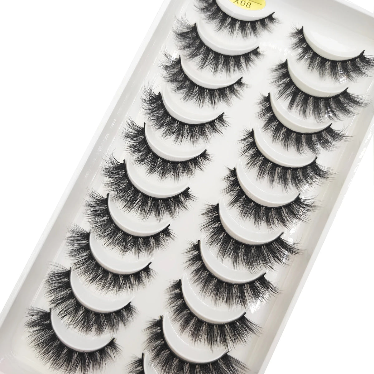 A tray of natural mink false eyelashes in various styles and lengths.