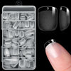 A clear plastic case containing twelve sizes of half cover almond press-on fake nails displayed next to a finger.