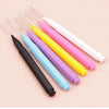 A collection of plastic handles for precision eyebrow and lash brushes in various colors including black, blue, yellow, pink,