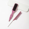 A set of two leopard print pointed tail hair combs, one pink and black, resting on a white surface.