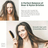 A woman is shown using a natural boar bristle hair brush to achieve smooth, shiny hair.