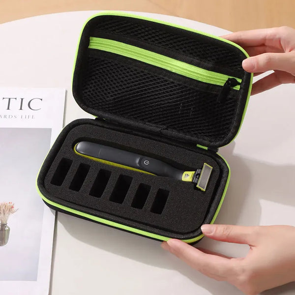 A black hard-shell travel case with a lime green trim holds an electric shaver and a razor.
