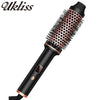 A black ceramic heated curling iron with a bristled barrel and a handle is shown.