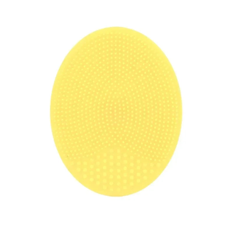 A round, yellow silicone facial cleansing brush with numerous small protrusions.