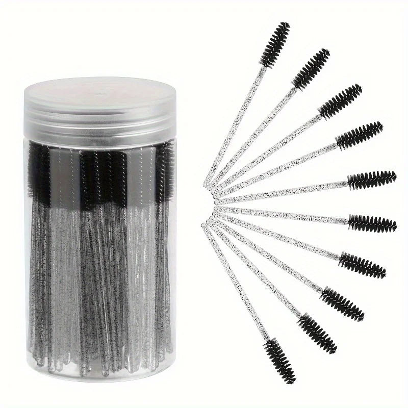 A container of disposable eyelash and eyebrow makeup brushes with black bristles.
