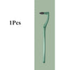 A green manual tooth stain remover tool with a curved handle and brush tip.