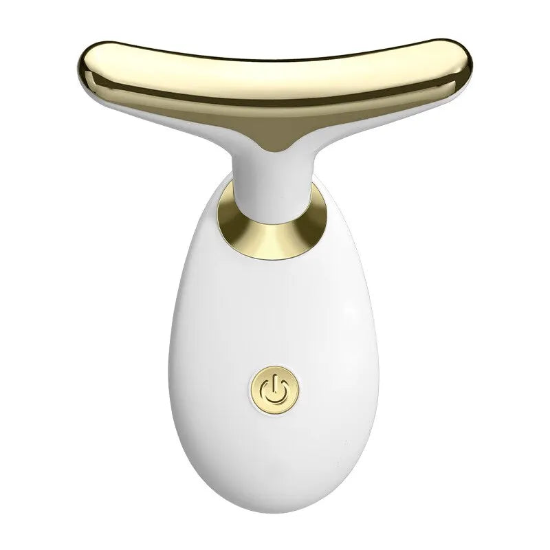 A white electric facial lifting and firming massager with a gold-colored handle.