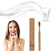 A woman holds up a white tooth and a bamboo toothbrush set against a white background.