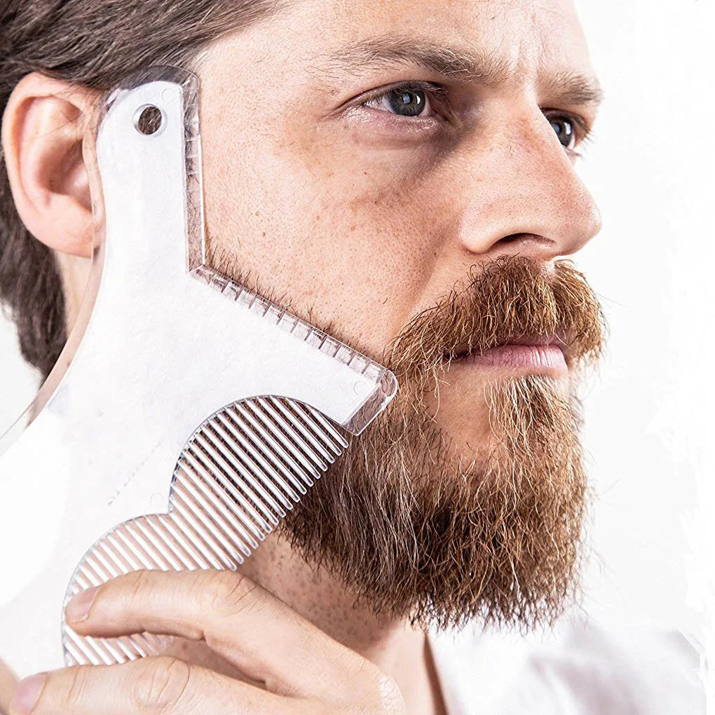 A man is using a clear plastic beard shaping tool on his face to style his beard.