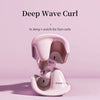 A pink deep wave curl wand is shown against a light pink background.