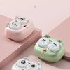Three small, round silicone cases for cleaning contact lenses in pink, mint green, and white.