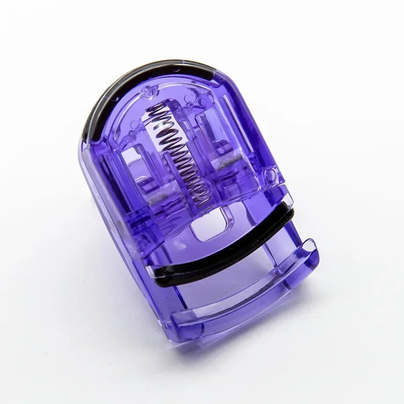 A purple mini folding eyelash curler set with a metal coil visible inside.