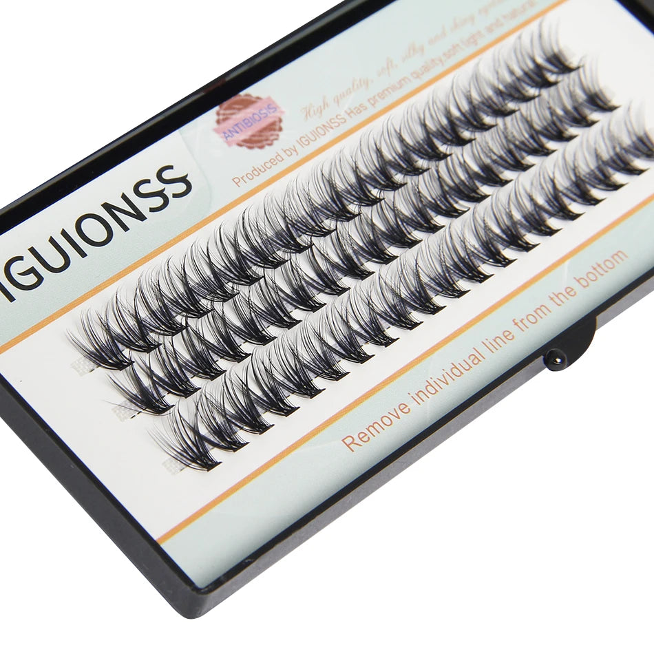 A close-up view of a DIY individual lash cluster product featuring natural wispy eyelash extensions.