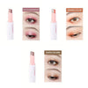 A set of three eyeshadow sticks in peach blossom, orange, and earth colors shown next to their packaging.