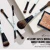 A set of six bright cyan makeup brushes displayed on a light background.
