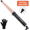A professional ceramic curling wand with a pink handle and black body, shown next to a black glove.
