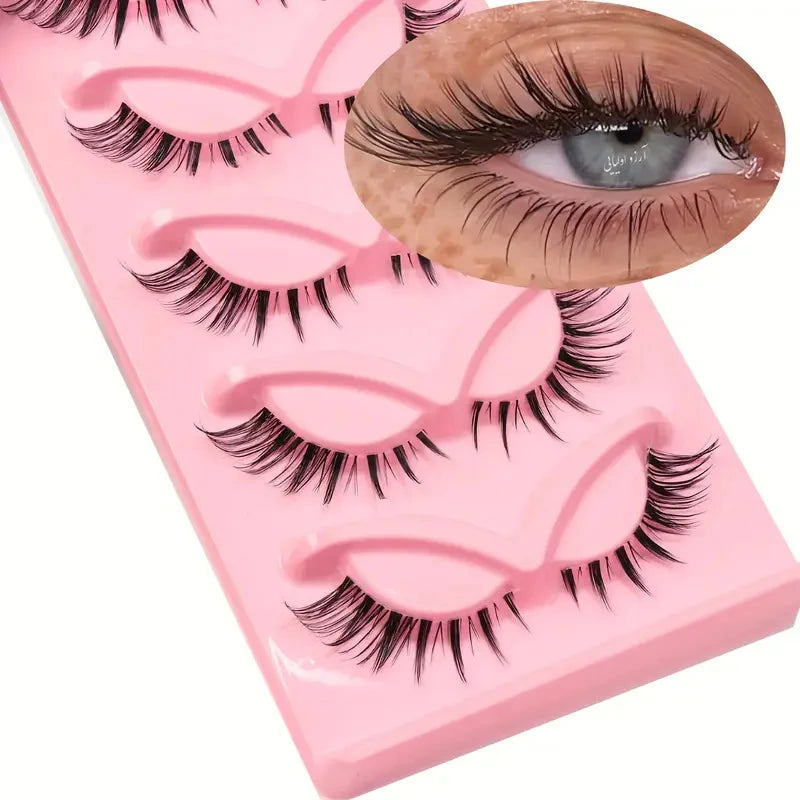 Plateau en plastique rose contenant un ensemble de faux cils noirs pour maquillage de chat œil.