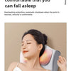 A woman is using a light gray massage pillow for relaxation, with the device visible on her neck and shoulder area.