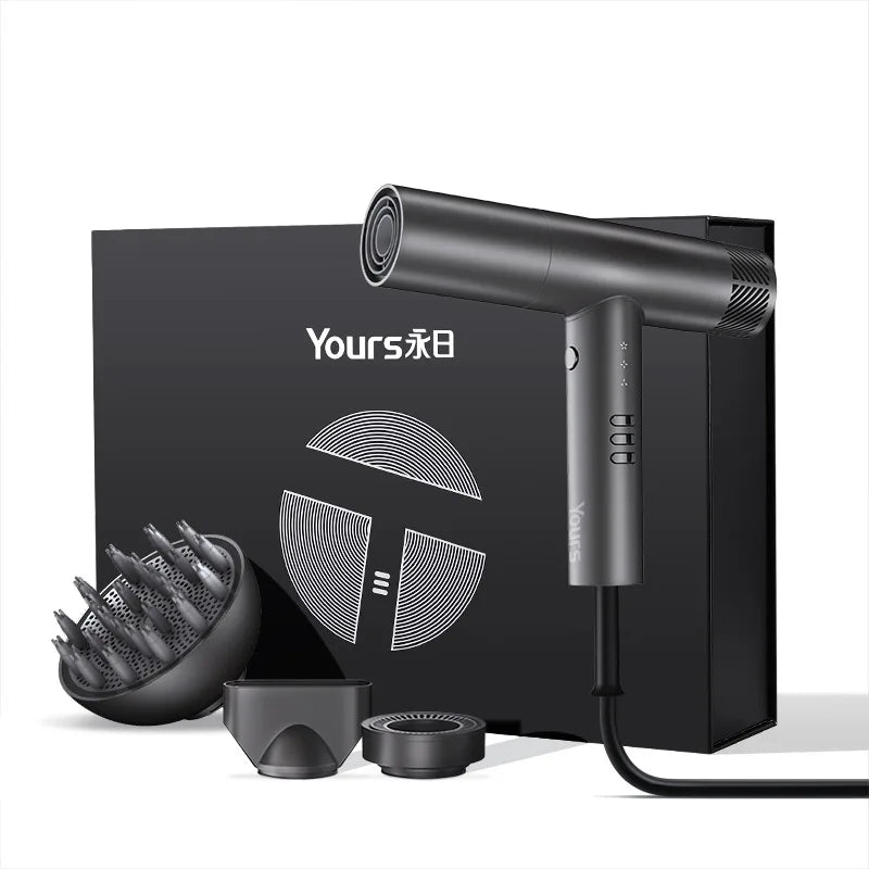 A black professional electric hair dryer is shown with its nozzle and accessories on a dark box.