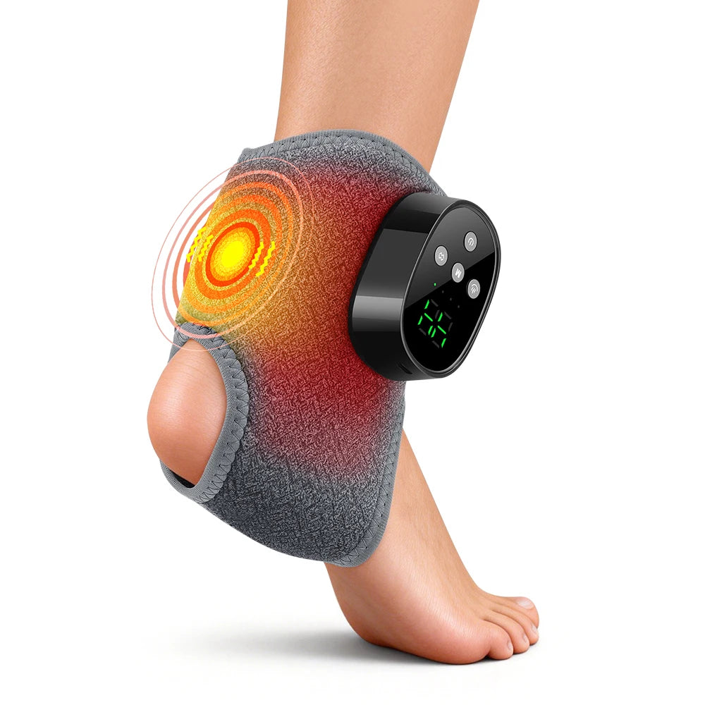 A person's ankle and foot is shown with a gray massager device applied to the skin.