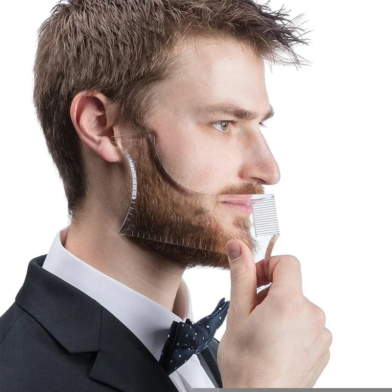 A man is using an all-in-one beard styling template and comb to shape his beard.