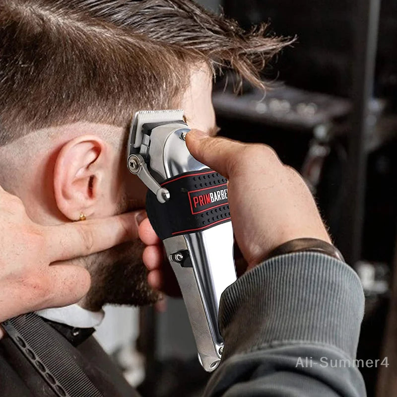 A person is using a silver trimmer grip on their ear for a close-up view.