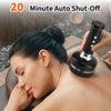 A woman is using a black cupping tool on her shoulder during a massage session.