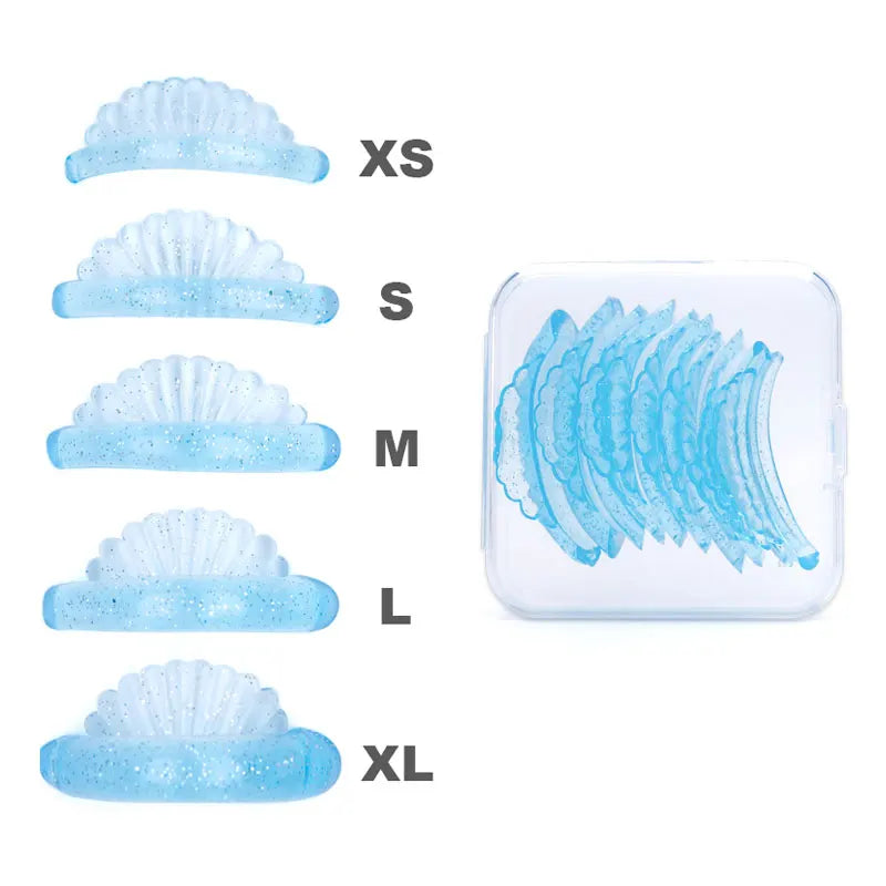 A set of blue eyelash curlers in sizes XS to XL displayed next to a clear plastic case.