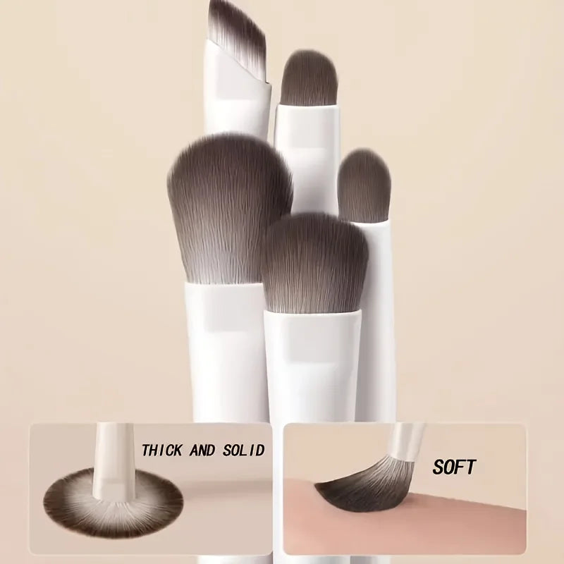 A set of five professional makeup brushes in white and gray tones shown with close-ups highlighting thick and solid bristles 