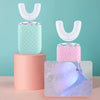 A pink and mint green 360° automatic sonic electric toothbrush set with a translucent brush head shown on a stand.
