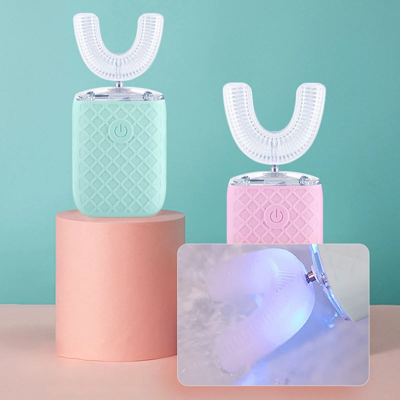 A pink and mint green 360° automatic sonic electric toothbrush set with a translucent brush head shown on a stand.