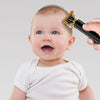 A baby is shown using a professional cordless electric hair clipper for fine chemical texture on their hairstyle.