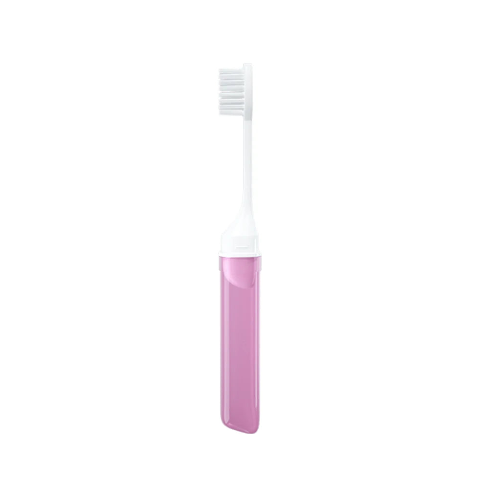 Un set de brosses à dents de voyage pliables roses avec une tête de brosse blanche.