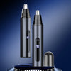 A pair of black USB rechargeable electric nose hair trimmers standing upright on a dark surface.