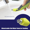 A hand is using a yellow electric shaver replacement blade to rinse under a water faucet or soaking.