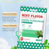 Un paquet de ficelles dentaires en cure-dents au menthe avec un design vert et blanc, mettant l'accent sur le facteur menthol