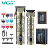 A set of professional electric hair trimmers and clippers in silver and black packaging.