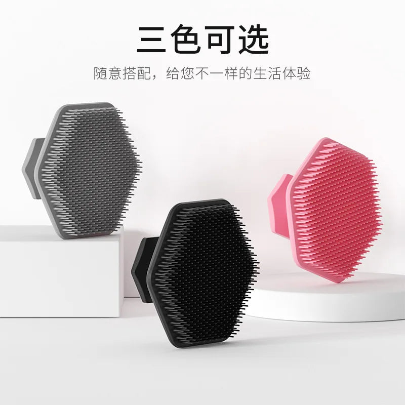 Three color silicone facial cleaning brushes displayed on a white surface.