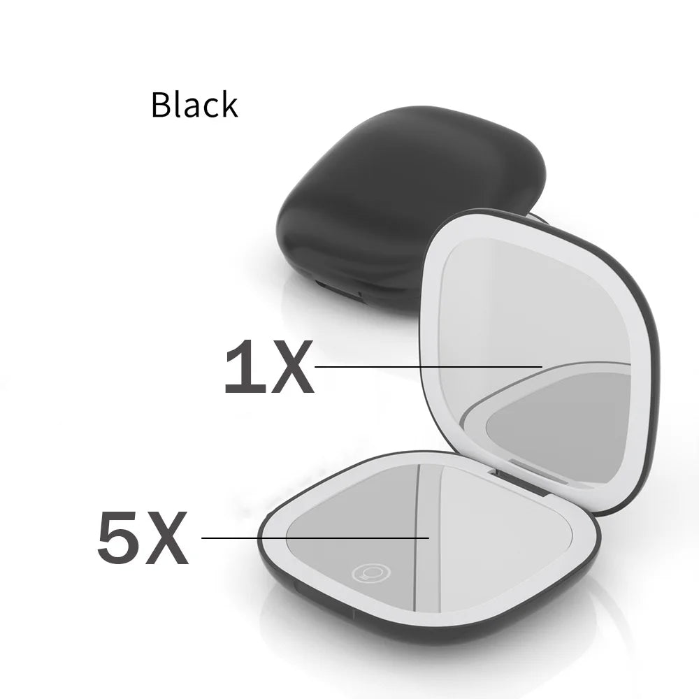 A black compact LED makeup mirror shown with a 1X and 5X magnification setting.