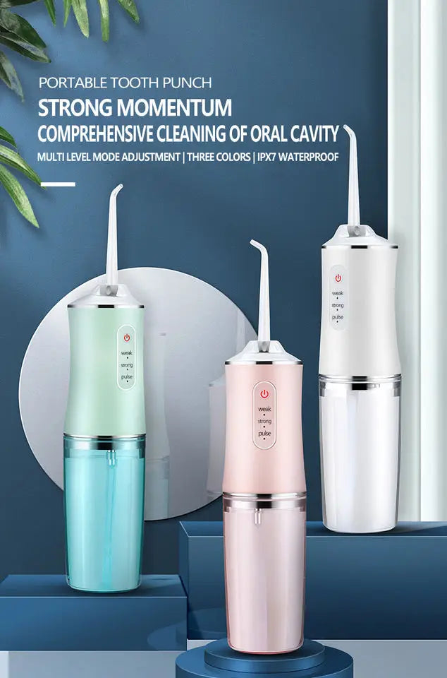 A portable tooth punch water flosser in three colors, including mint green and pink, displayed against a dark blue background