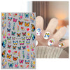 A collection of colorful flower and butterfly nail stickers for DIY decoration shown on a hand.