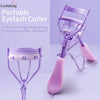 A purple portable eyelash curler with a pink handle and metal curler tool shown in detail.