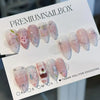 A display of premium nailbox featuring 24 pink heart pearl press-on fake nails.