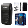 A black Kemei electric shaver set including the shaver, accessories, and USB charging cable.
