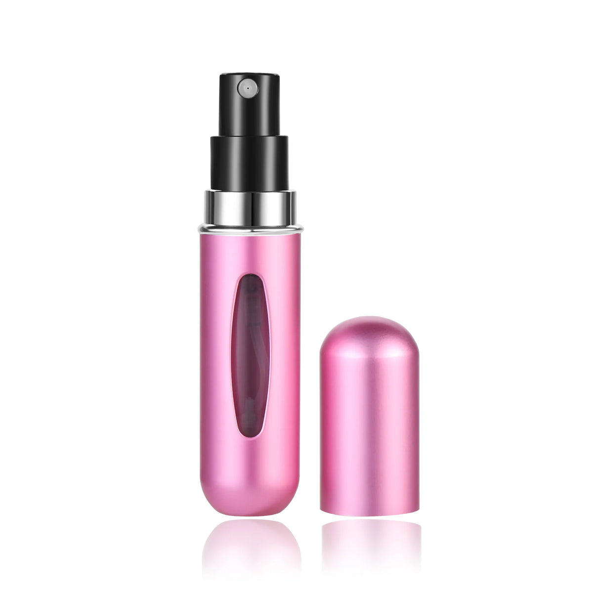 A pink glass perfume bottle with a black pump dispenser and a separate pink refill bottle.