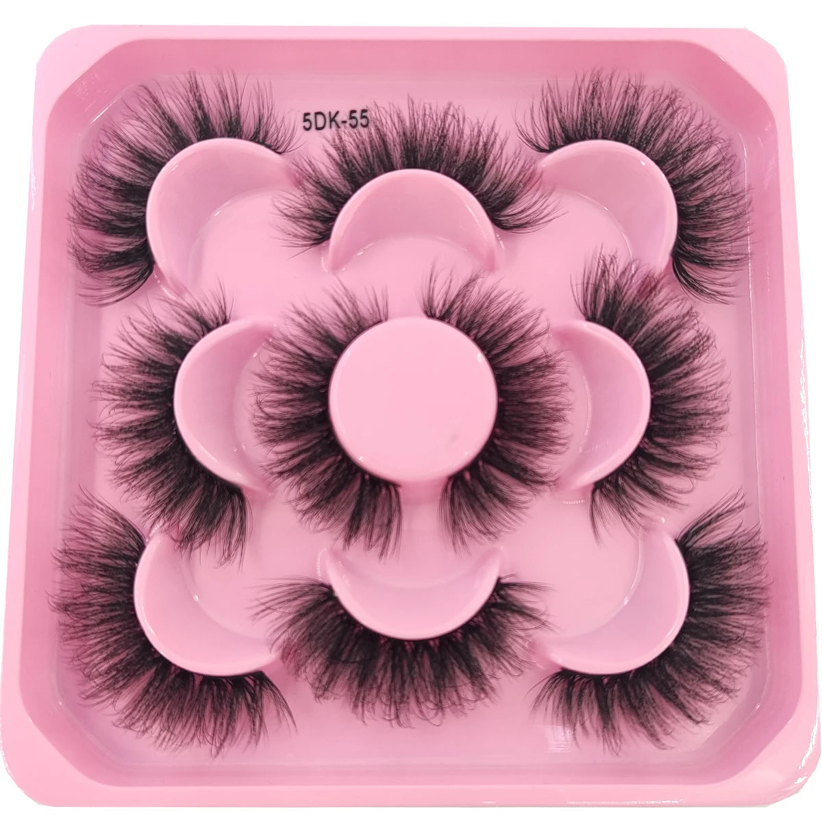 A pink plastic tray holding a set of black artificial mink eyelashes
