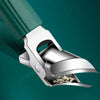 Close-up of silver ergonomic beveled nail clippers with a green handle against a dark teal background.