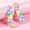 A set of double-sided nail files and buffing blocks featuring a colorful butterfly pattern on pink packaging.